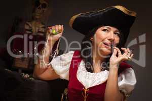 Dramatic Female Pirate Biting A Coin
