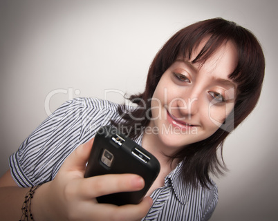 Smiling Brunette Woman Using Cell Phone