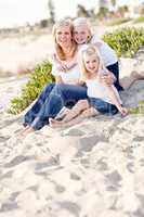 Pretty Mom and Her Cute Daughters at The Beach