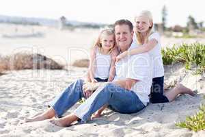 Handsome Dad and His Cute Daughters at The Beach