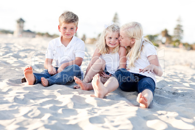 Adorable Sisters and Brother Having Fun at the Beach