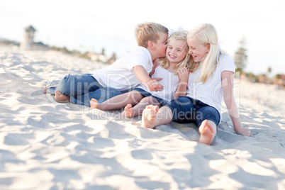 Adorable Sibling Children Kissing the Youngest