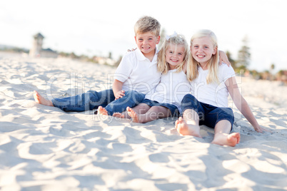 Adorable Sisters and Brother Having Fun at the Beach