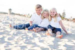 Adorable Sisters and Brother Having Fun at the Beach