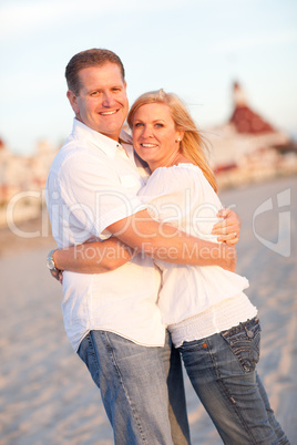 Attractive Caucasian Couple Hugging at the Beach