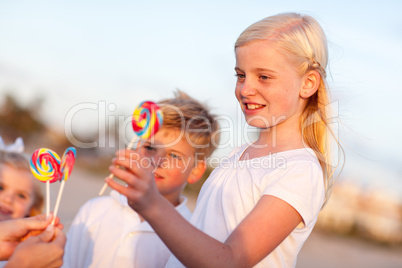 Cute Brother and Sisters Picking out Lollipop