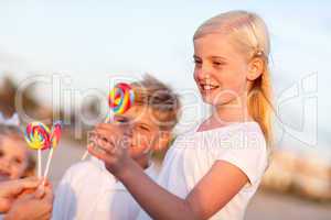 Cute Brother and Sisters Picking out Lollipop