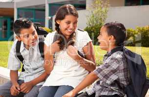 Hispanic Brothers and Sister Talking Ready for School