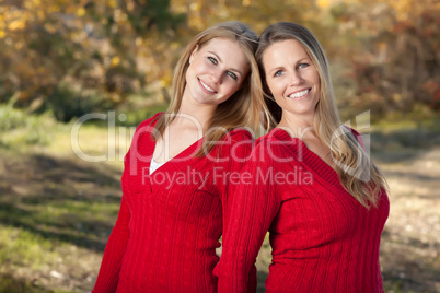 Pretty Mother and Daughter Portrait in Park