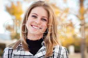 Pretty Young Woman Smiling in the Park