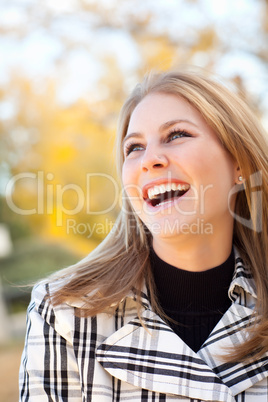 Pretty Young Woman Smiling in the Park