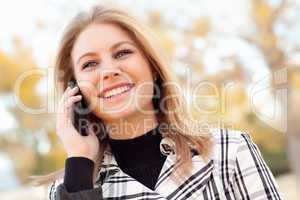 Pretty Young Blond Woman on Phone Outside