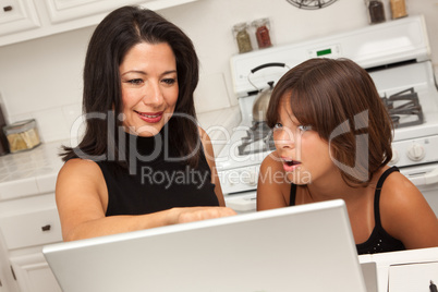 Hispanic Mother and Mixed Race Daughter on the Laptop