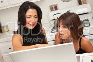 Hispanic Mother and Mixed Race Daughter on the Laptop