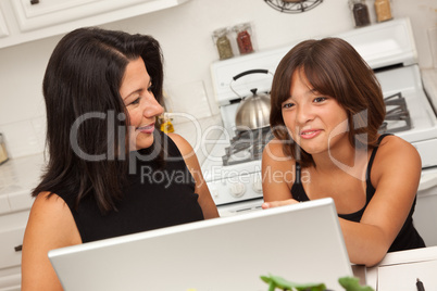 Hispanic Mother and Mixed Race Daughter on the Laptop