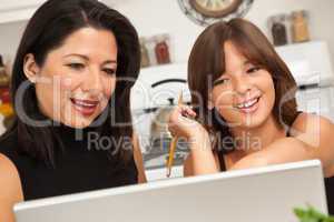 Hispanic Mother and Mixed Race Daughter on the Laptop