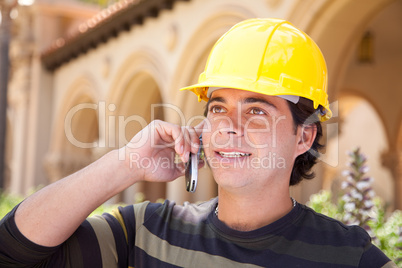 Handsome Hispanic Contractor on Phone with Hard Hat Outside