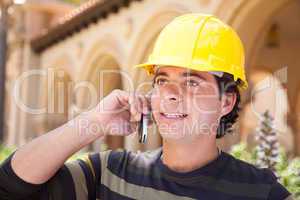 Handsome Hispanic Contractor on Phone with Hard Hat Outside