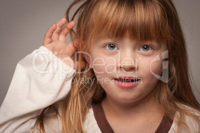 Fun Portrait of an Adorable Red Haired Girl on Grey