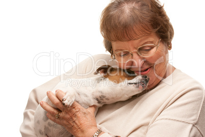 Happy Attractive Senior Woman with Puppy on White