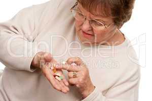 Attractive Senior Woman and Medication Pills.