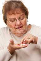 Attractive Senior Woman and Medication Pills.