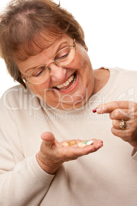 Attractive Senior Woman and Medication Pills.