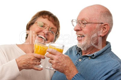 Happy Senior Couple with Glasses of Orange Juice