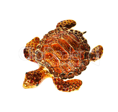 Metal tortoise with crystals on the white background (souvenir)