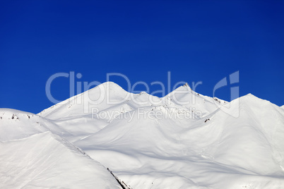 Snow-white mountains and blue sky