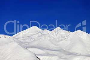 Snow-white mountains and blue sky