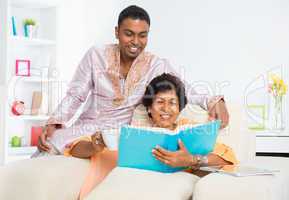 Indian family reading a book