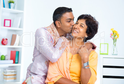 Indian male kissing his mother