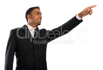 Indian businessman pointing to blank space