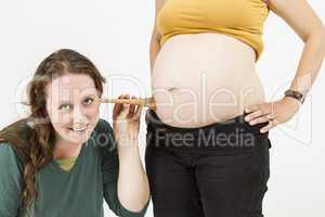 midwife listening at human belly