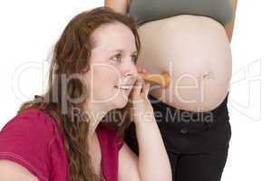 midwife listening at human belly