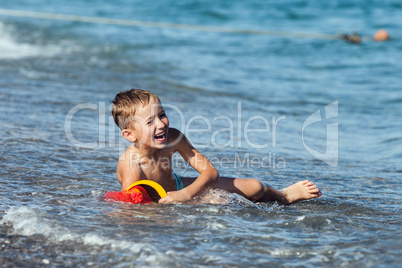 Child boy on sea beach