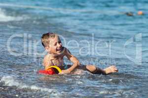 Child boy on sea beach