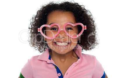Profile shot of a cute smiling girl with glasses