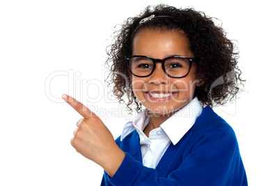 Smiling young school girl with glasses.