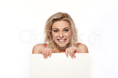 Happy blonde woman with blank sign