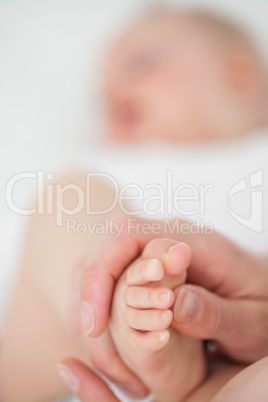 Feet of a baby being touched