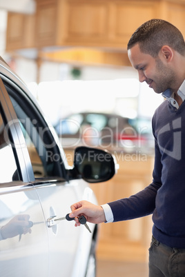 Man inserting a car key