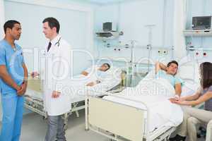 Doctor and male nurse in a hospital room