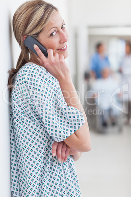 Female patient phoning in a hospital