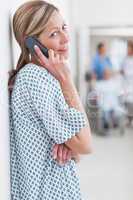 Female patient phoning in a hospital