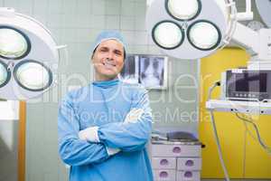 Smiling surgeon in operating theatre