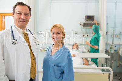 Doctor and nurse talking in a hospital room