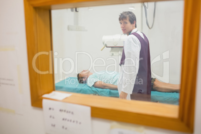 View of practitioner doing a radiography through a window