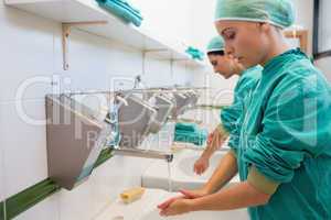 Two surgeons washing their hands